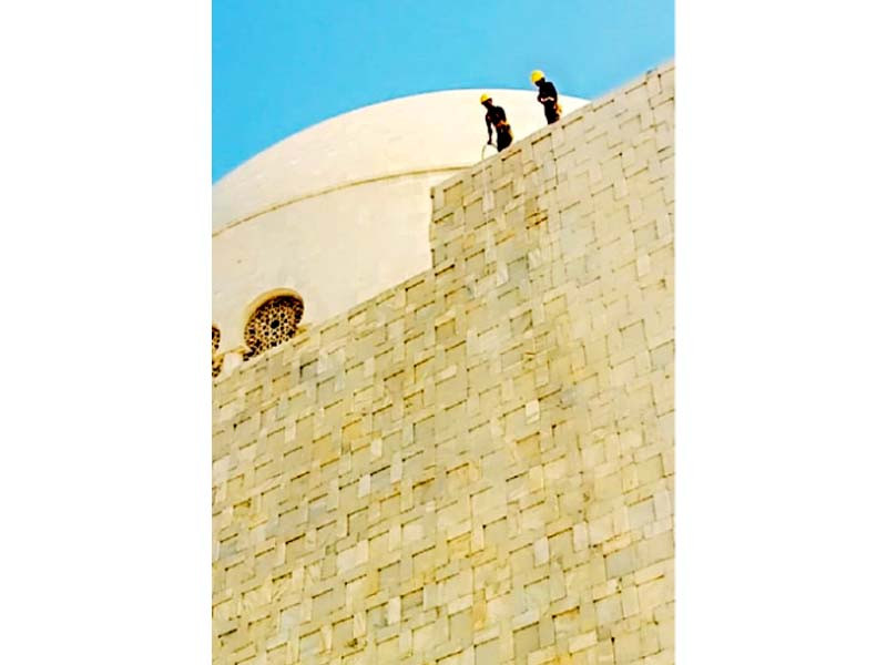 workers wash the marble walls of the mausoleum of quaid i azam ahead of his birth anniversary due on december 25 photo express