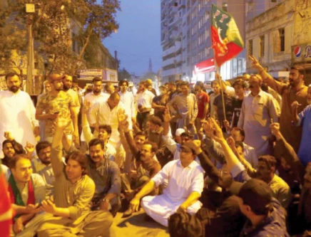 people stage protest at shaheen complex intersection on ii chundrigar road against attempts to arrest pti chairman imran khan photo ppi