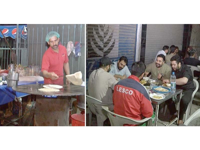 a vendor prepares parathas while a group of customers have their table full of a variety of freshly cooked meal for sehri photo express