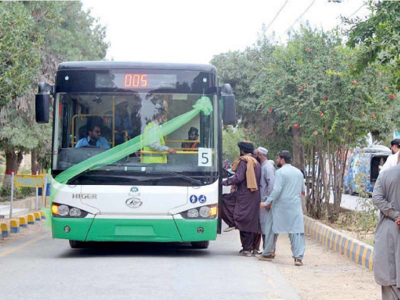 passengers board an eagerly awaited green bus after it was inaugurated by the balochistan government in quetta photo app