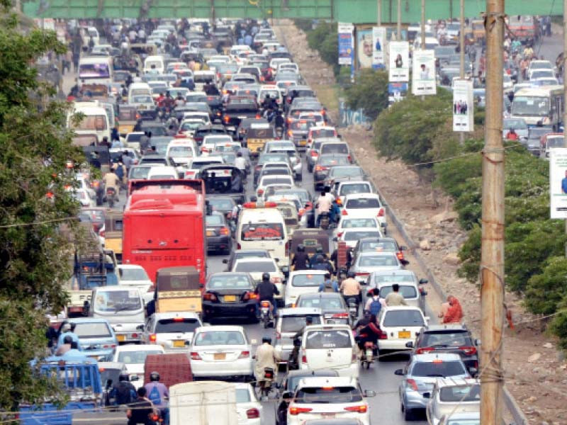 vehicles stuck in a traffic jam on sharea faisal due to the protest by jamaat e islami against frequent increases in electricity and fuel prices by the caretaker government photo jalal qureshi express
