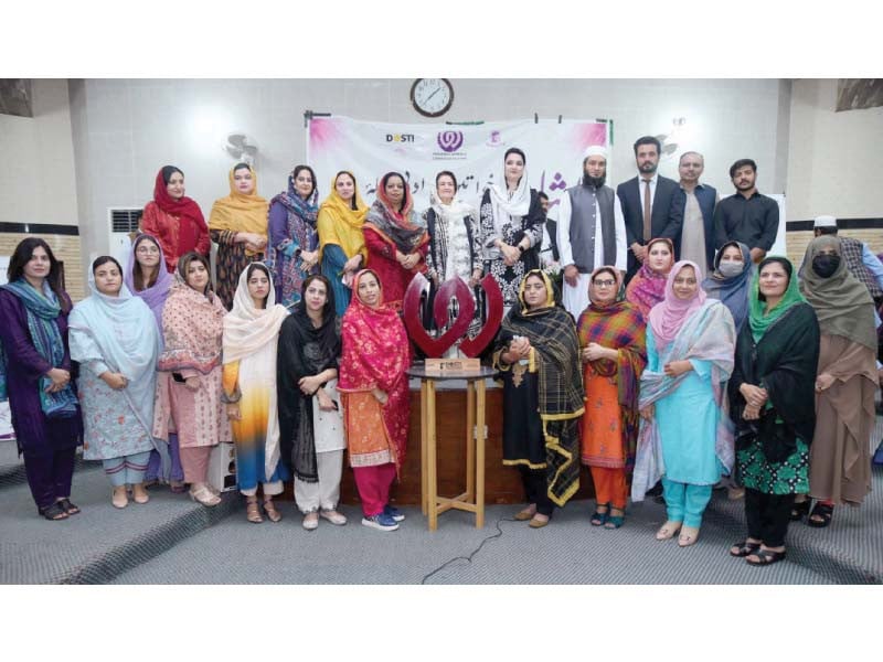 mayor of peshawar haji zubair ali along with other participants poses for a photo during the inauguration ceremony of the dosti peshawar women s literature festival photo ppi