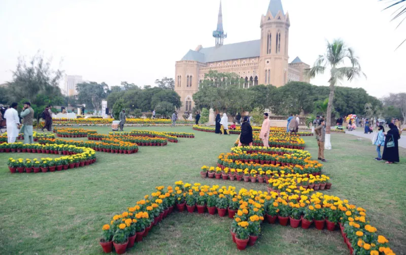 people walk among marigold plants on display at frere hall on friday photo ppi people walk among marigold plants on display at frere hall on friday photo ppi
