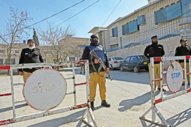 policemen stand guard outside the provincial election commission office ahead of the upcoming general elections in quetta photo afp policemen stand guard outside the provincial election commission office ahead of the upcoming general elections in quetta photo afp