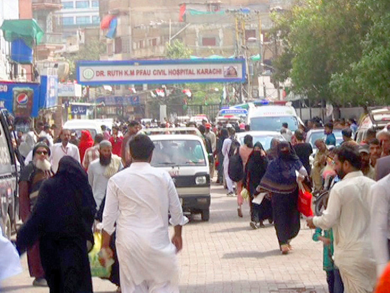 a rush of people is seen at the gate of dr ruth km pfau civil hospital as the city faces an outbreak of respiratory diseases photo express