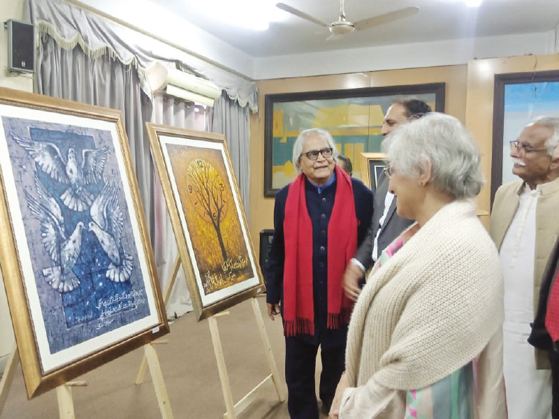 engrossed visitors admire poetry inspired paintings at the academy of literature pakistan exhibition photo express