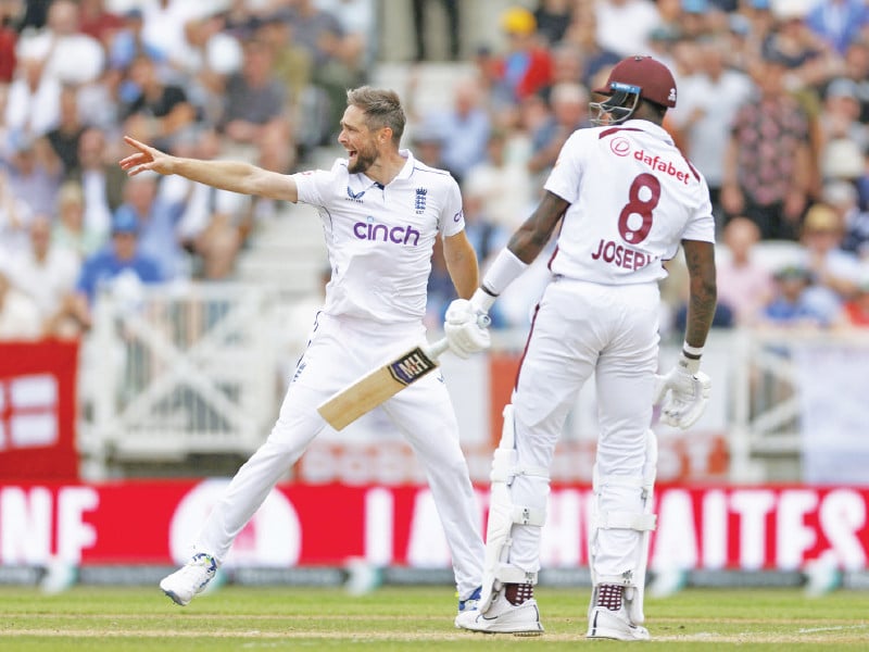 england s chris woakes celebrates taking the wicket of west indies alzarri joseph caught out by jamie smith photo reuters