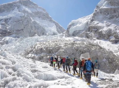 climbers open everest route past dangerous ice block