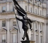 banksy owns up to statue of man blinded by flag