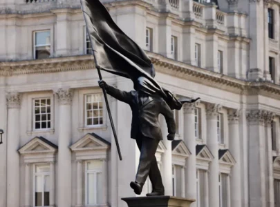 banksy owns up to statue of man blinded by flag