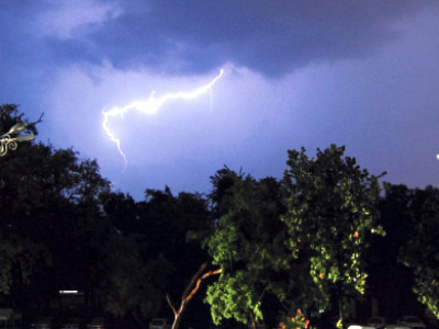 mighty rain fells power wires and branches inundates roads