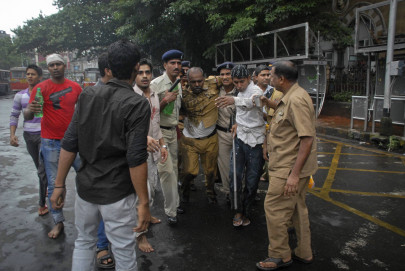 two killed in mumbai as city protest turns violent