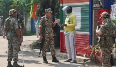 security personnel stop a delivery man as they stand guard along a road in kolkata photo reuters