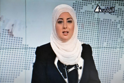 egypt s first veiled news anchor appears on state tv