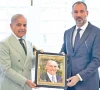 pm shehbaz sharif presents a commemorative postal stamp to prince rahimaga khan v to honour his late father prince karim aga khan iv for his services to pakistan photo app
