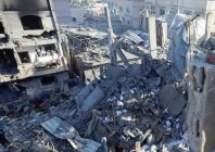 a palestinian boy looks at the site of an israeli strike on a house in gaza photo reuters