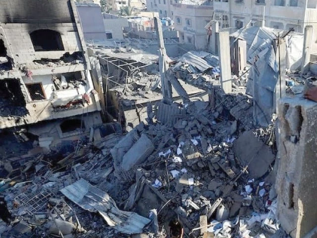 a palestinian boy looks at the site of an israeli strike on a house in gaza photo reuters a palestinian boy looks at the site of an israeli strike on a house in gaza photo reuters