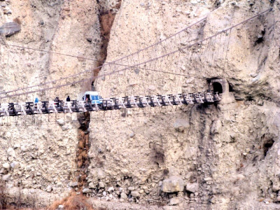 defying government orders people remove barricades cross the dangerous danyore bridge