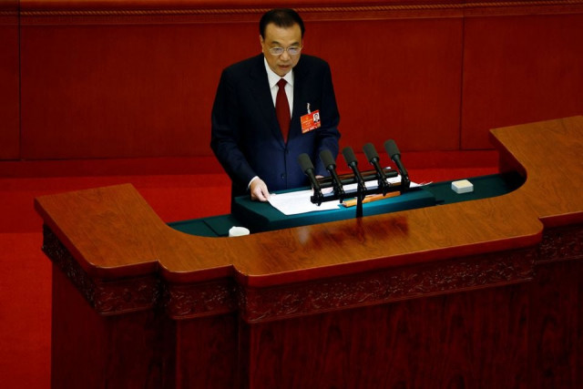 chinese premier li keqiang speaks at the opening session of the national people s congress npc at the great hall of the people in beijing china march 5 2022 photo reuters chinese premier li keqiang speaks at the opening session of the national people s congress npc at the great hall of the people in beijing china march 5 2022 photo reuters