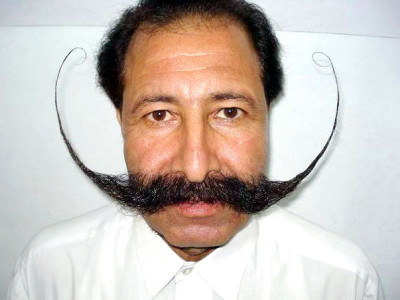 dramatic moustache causes man to flee hometown