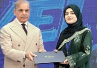 prime minister shehbaz sharif presents a laptop to a student in gilgit photo ppi