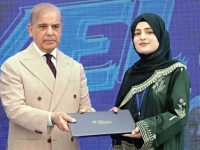 prime minister shehbaz sharif presents a laptop to a student in gilgit photo ppi