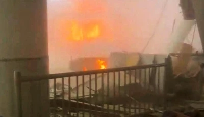 this screengrab from a social media video shows debris on the floor as fire burns in the background after a strike at kuwait international airport in kuwait city photo reuters