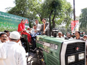 farmers receive tractors under green scheme
