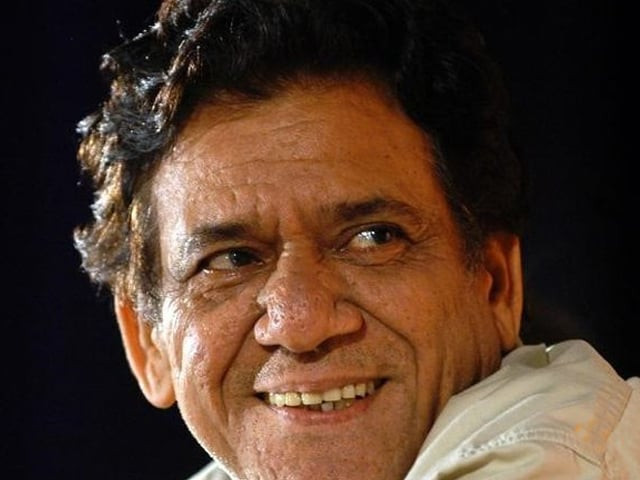 indian actor om puri smiles during his felicitation ceremony organized by the quot rotry club of mumbai quot in bombay august 15 2004 photo reuters