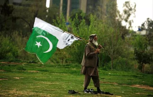a supporter of the jamaat ud dawa islamic organization holds a pakistani national flag photo faisal mahmood reuters a supporter of the jamaat ud dawa islamic organization holds a pakistani national flag photo faisal mahmood reuters