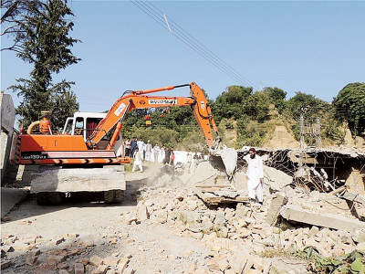 anti encroachment drive two houses part of shrine demolished