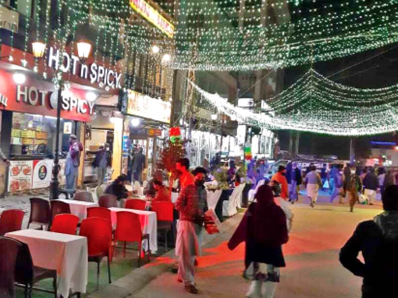 people enjoy culinary delights at the food street in saddar photo express