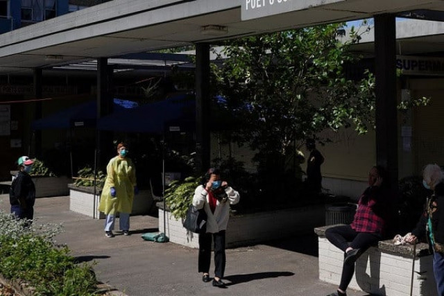 a health worker is stationed at a coronavirus disease covid 19 testing clinic set up for residents of surrounding public housing towers in the redfern suburb where authorities are working to contain an emerging cluster of cases as widespread lockdown continues in sydney australia september 17 2021 photo reuters
