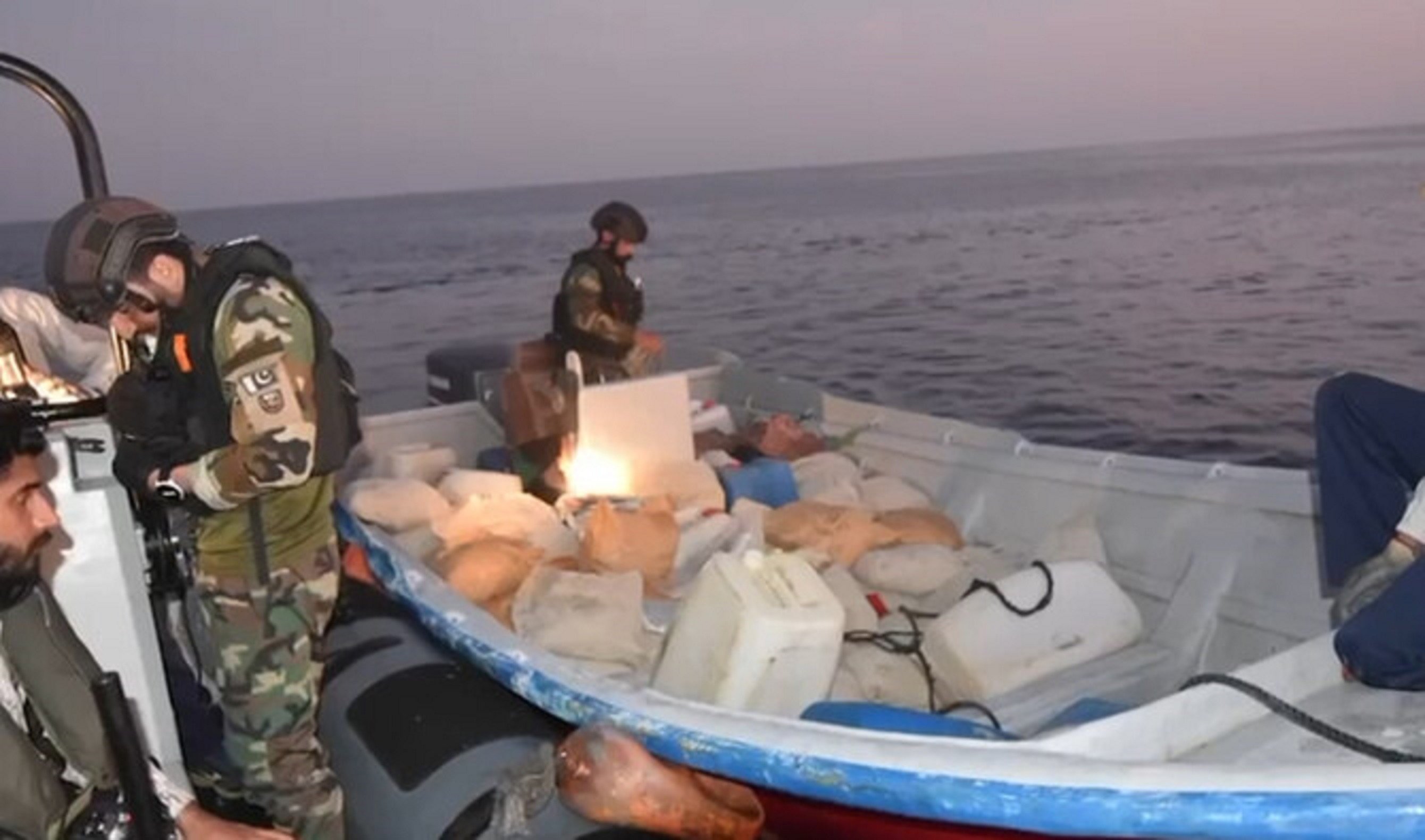 this screengrab taken from a handout video released by pakistan navy shared on october 17 2024 shows pakistan navy personnel seizing drugs during a targeted operation in the north arabian sea photo pakistan navy