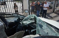 people look at a damaged car where an artillery shell fell before it was removed by israeli police in raanana near tel aviv on nov 6 2024 following a reported barrage of rockets launched from lebanon toward israel photo afp