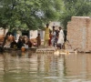 residents stand at their partially submerged house as they wait to evacuate a flooded area following monsoon rains and rising water levels of the chenab river in jalalpur pirwala punjab photo reuters residents stand at their partially submerged house as they wait to evacuate a flooded area following monsoon rains and rising water levels of the chenab river in jalalpur pirwala punjab photo reuters