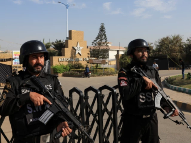 members of the special security unit ssu stand guard outside national bank stadium ahead of the icc champions trophy 2025 tournament in karachi pakistan on february 14 2025 photo reuters