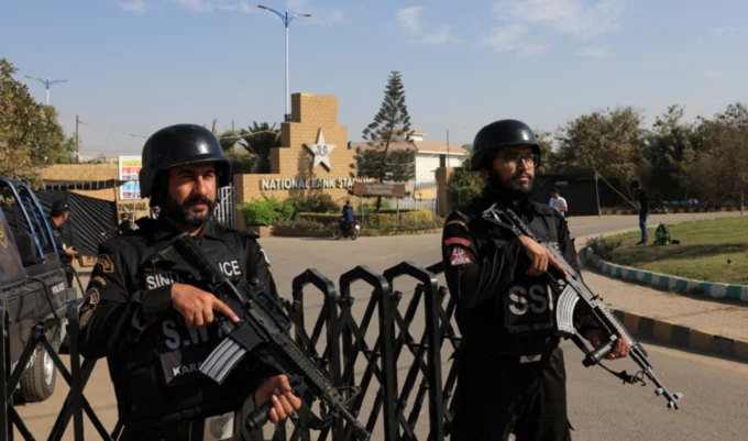 members of the special security unit ssu stand guard outside national bank stadium ahead of the icc champions trophy 2025 tournament in karachi pakistan on february 14 2025 photo reuters members of the special security unit ssu stand guard outside national bank stadium ahead of the icc champions trophy 2025 tournament in karachi pakistan on february 14 2025 photo reuters