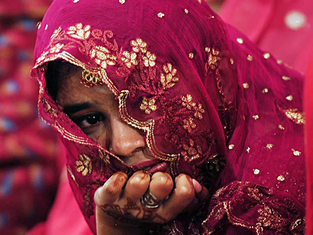 a pakistani bride looks on during a mass wedding ceremony in karachi some 115 couples participated in the ceremony organised by a local charity welfare trust photo afp a pakistani bride looks on during a mass wedding ceremony in karachi some 115 couples participated in the ceremony organised by a local charity welfare trust photo afp
