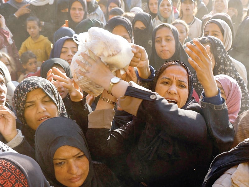 palestinians gather to buy bread in khan younis photo reuters