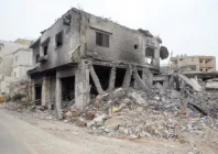 a displaced woman stands outside her home after returning to hannawiyeh in southern lebanon on april 18 2026 photo afp