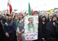 a woman holds a poster depicting iran s new supreme leader mojtaba khamenei during a rally in tehran photo reuters