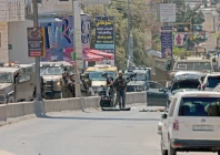 israeli troops stand near the scene of a shooting during a raid in qalandia in the israeli occupied west bank photo reuters