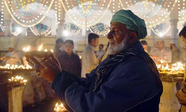 a sufi dances outside the data darbar complex which contains the shrine of saint syed ali bin osman al hajvery popularly known as data ganj bakhsh photo afp a sufi dances outside the data darbar complex which contains the shrine of saint syed ali bin osman al hajvery popularly known as data ganj bakhsh photo afp