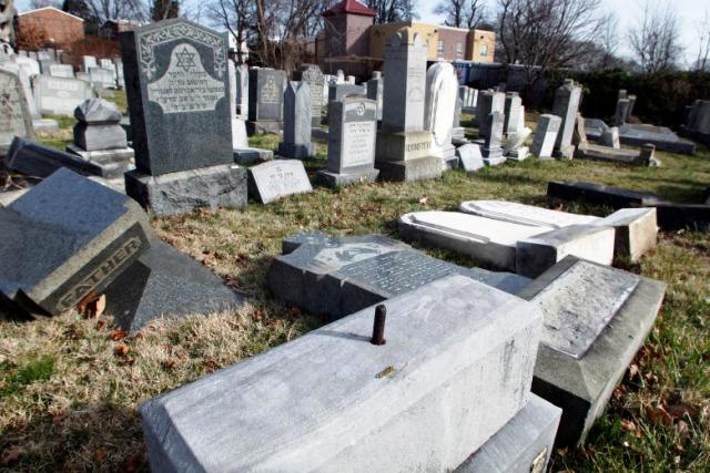 headstones lay on the ground after vandals pushed them off their bases in the mount carmel cemetery in philadelphia photo reuters tom mihalek