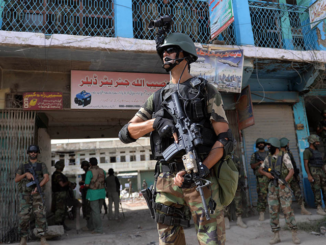 soldiers patrol at an empty bazaar during a military operation against taliban militants in the main town of miramshah in north waziristan on july 9 2014 photo afp