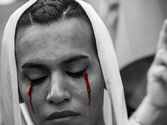 lgbt member with make up on her face attends on august 21 2016 in istanbul a demonstration for the murdering of a transgender activist hande kader a 22 year old transgender who was mutilated burnt and murdered in istanbul photo afp