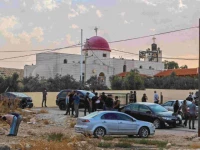people and security forces gather outside a greek orthodox church in the hammoud village in jordan after a shooting incident photo afp