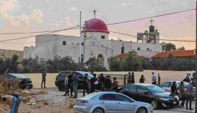 people and security forces gather outside a greek orthodox church in the hammoud village in jordan after a shooting incident photo afp