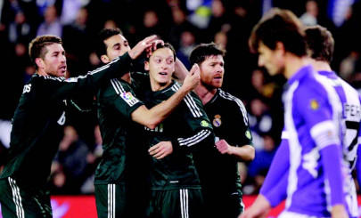 football ozil strikes twice as madrid win